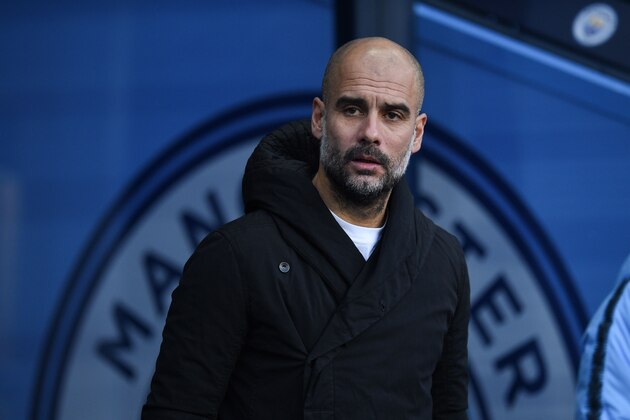 Manchester City's Spanish manager Pep Guardiola arrives for the English Premier League football match between Manchester City and Crystal Palace at the Etihad Stadium in Manchester, north west England, on December 22, 2018. (Photo by Oli SCARFF / AFP) / RESTRICTED TO EDITORIAL USE. No use with unauthorized audio, video, data, fixture lists, club/league logos or 'live' services. Online in-match use limited to 120 images. An additional 40 images may be used in extra time. No video emulation. Social media in-match use limited to 120 images. An additional 40 images may be used in extra time. No use in betting publications, games or single club/league/player publications. /         (Photo credit should read OLI SCARFF/AFP/Getty Images)