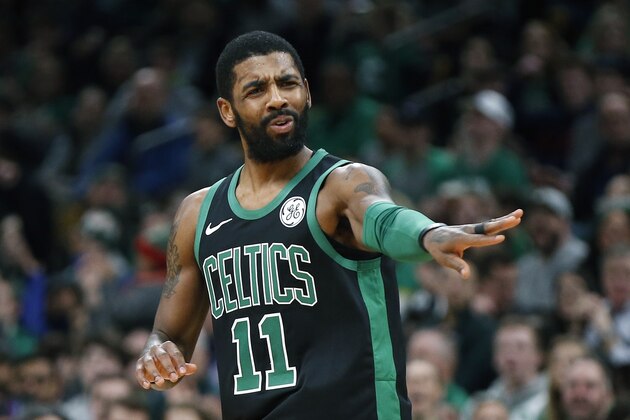 Boston Celtics' Kyrie Irving reacts after making a three-pointer during the first half of an NBA basketball game against the Charlotte Hornets in Boston, Sunday, Dec. 23, 2018. (AP Photo/Michael Dwyer)