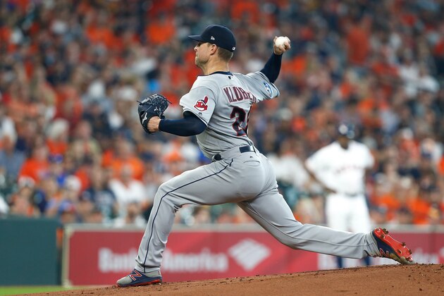 HOUSTON, TX - OCTOBER 05:  Corey Kluber #28 of the Cleveland Indians delivers a pitch in the first inning against the Houston Astros during Game One of the American League Division Series at Minute Maid Park on October 5, 2018 in Houston, Texas.  (Photo by Bob Levey/Getty Images)