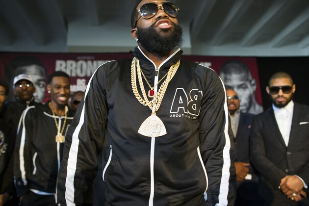 Four-division world champion Adrien Broner, center, taunts Ashley Theophane at a news conference in Washington, Monday, Feb. 29, 2016, ahead of their world title showdown. The fight is scheduled to be held at the D.C. Armory, April 1, 2016. (AP Photo/Cliff Owen)
