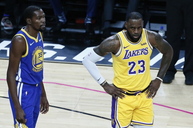 LAS VEGAS, NV- OCTOBER 10:   LeBron James #23 of the Los Angeles Lakers and Kevin Durant #35 of the Golden State Warriors look on during the game on October 10, 2018 at T-Mobile Arena in Las Vegas, Nevada. NOTE TO USER: User expressly acknowledges and agrees that, by downloading and/or using this Photograph, user is consenting to the terms and conditions of the Getty Images License Agreement. Mandatory Copyright Notice: Copyright 2018 NBAE (Photo by Chris Elise/NBAE via Getty Images)