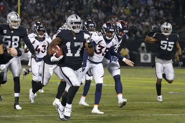 Oakland Raiders' Dwayne Harris (17) returns a punt for a touchdown against the Denver Broncos during the first half of an NFL football game in Oakland, Calif., Monday, Dec. 24, 2018. (AP Photo/D. Ross Cameron)