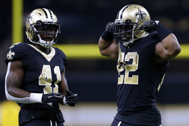 NEW ORLEANS, LA - JANUARY 07: Mark Ingram #22 of the New Orleans Saints and Alvin Kamara #41 react during the NFC Wild Card playoff game against the Carolina Panthers at the Mercedes-Benz Superdome on January 7, 2018 in New Orleans, Louisiana.  (Photo by Jonathan Bachman/Getty Images)