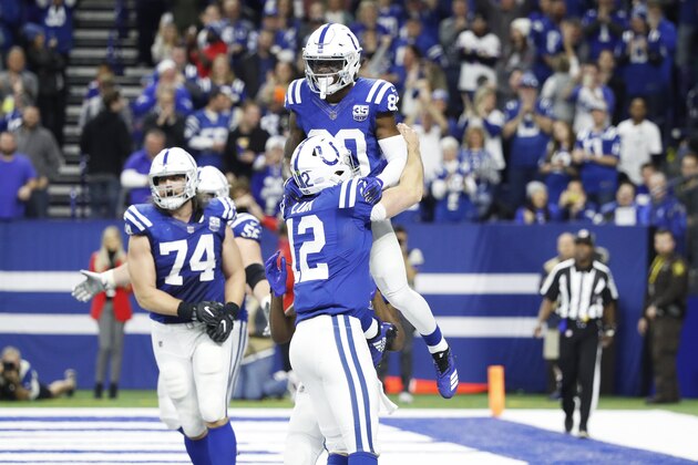 INDIANAPOLIS, IN - DECEMBER 23: Andrew Luck #12 of the Indianapolis Colts lifts Chester Rogers #80 after the winning touchdown during the game against the New York Giants at Lucas Oil Stadium on December 23, 2018 in Indianapolis, Indiana. The Colts won 28-27. (Photo by Joe Robbins/Getty Images)