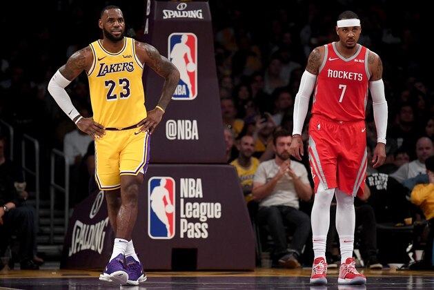 LOS ANGELES, CA - OCTOBER 20:  LeBron James #23 of the Los Angeles Lakers and Carmelo Anthony #7 of the Houston Rockets wait for and inbound at Staples Center on October 20, 2018 in Los Angeles, California.  (Photo by Harry How/Getty Images)