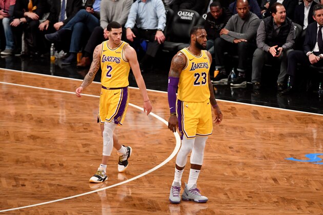 BROOKLYN, NY - DECEMBER 18: Lonzo Ball #2 of the Los Angeles Lakers and LeBron James #23 during the game against the Brooklyn Nets on December 18, 2018 at Barclays Center in Brooklyn, New York. NOTE TO USER: User expressly acknowledges and agrees that, by downloading and or using this Photograph, user is consenting to the terms and conditions of the Getty Images License Agreement. Mandatory Copyright Notice: Copyright 2018 NBAE (Photo by Jesse D. Garrabrant/NBAE via Getty Images)
