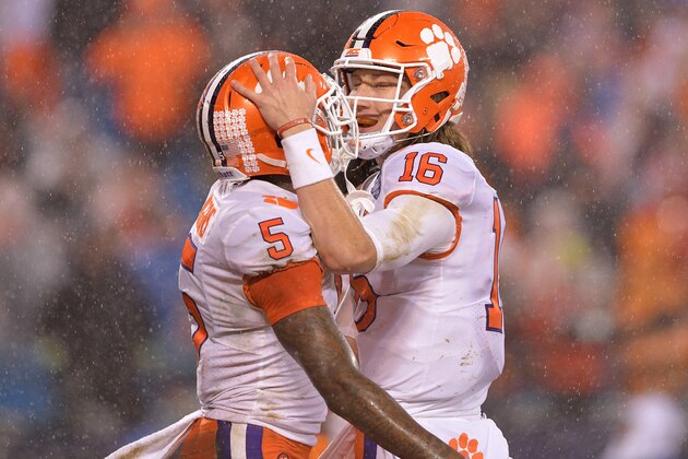 CHARLOTTE, NC - DECEMBER 01:  Tee Higgins #5 celebrates with Trevor Lawrence #16 of the Clemson Tigers after scoring a touchdown against the Pittsburgh Panthers during the second quarter of their game at Bank of America Stadium on December 1, 2018 in Charlotte, North Carolina.  (Photo by Grant Halverson/Getty Images)