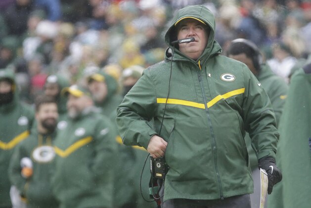 Green Bay Packers' Head Coach Mike McCarthy watches a replay on the scoreboard during the first half of an NFL football game against the Arizona Cardinals Sunday, Dec. 2, 2018, in Green Bay, Wis. (AP Photo/Mike Roemer)