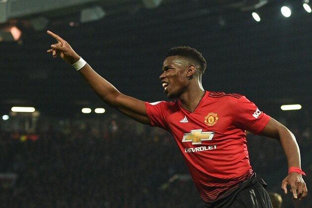 Manchester United's French midfielder Paul Pogba celebrates scoring their second goal during the English Premier League football match between Manchester United and Huddersfield Town at Old Trafford in Manchester, north west England, on December 26, 2018. (Photo by Oli SCARFF / AFP) / RESTRICTED TO EDITORIAL USE. No use with unauthorized audio, video, data, fixture lists, club/league logos or 'live' services. Online in-match use limited to 120 images. An additional 40 images may be used in extra time. No video emulation. Social media in-match use limited to 120 images. An additional 40 images may be used in extra time. No use in betting publications, games or single club/league/player publications. /         (Photo credit should read OLI SCARFF/AFP/Getty Images)