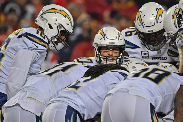 KANSAS CITY, MO - DECEMBER 13:  Quarterback Philip Rivers (C) of the Los Angeles Chargers calls out a play in the huddle during the first half against the Kansas City Chiefs on December 13, 2018 at Arrowhead Stadium in Kansas City, Missouri.  (Photo by Peter G. Aiken/Getty Images)