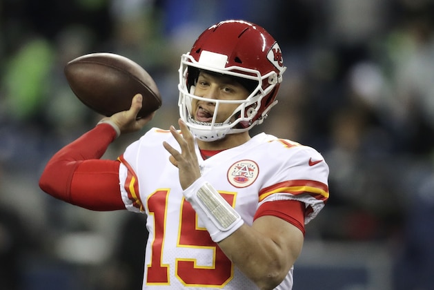 Kansas City Chiefs quarterback Patrick Mahomes passes during warmups before an NFL football game against the Seattle Seahawks, Sunday, Dec. 23, 2018, in Seattle. (AP Photo/Stephen Brashear)