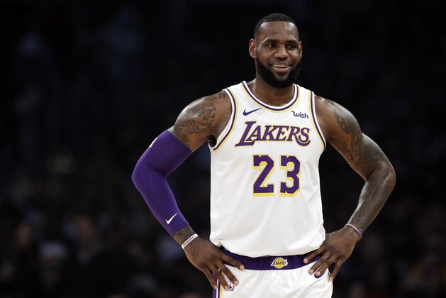 Los Angeles Lakers' LeBron James (23) smiles during a break in action during the first half of an NBA basketball game against the Memphis Grizzlies Sunday, Dec. 23, 2018, in Los Angeles. (AP Photo/Marcio Jose Sanchez)