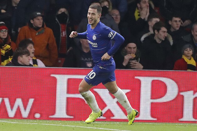 Chelsea's Eden Hazard, celebrates after scoring form penalty his side second goal during the English Premier League soccer match between Watford and Chelsea at Vicarage Road stadium in Watford, England on Wednesday, Dec. 26, 2018. (AP Photo/Frank Augstein)