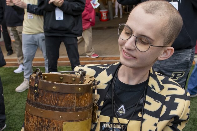 BLOOMINGTON, IN - NOVEMBER 24: Purdue fan Tyler Trent holds the Ol' Oaken Bucket following the game against the Indiana Hoosiers at Memorial Stadium on November 24, 2018 in Bloomington, Indiana. (Photo by Michael Hickey/Getty Images)