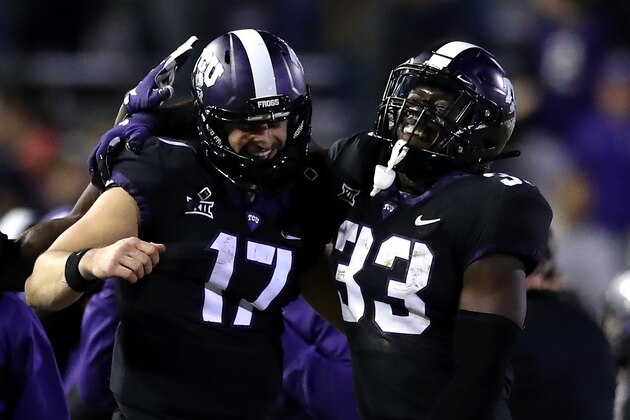 FORT WORTH, TEXAS - NOVEMBER 24:  Grayson Muehlstein #17 of the TCU Horned Frogs and Sewo Olonilua #33 celebrate a touchdown against the Oklahoma State Cowboys at Amon G. Carter Stadium on November 24, 2018 in Fort Worth, Texas. (Photo by Ronald Martinez/Getty Images)