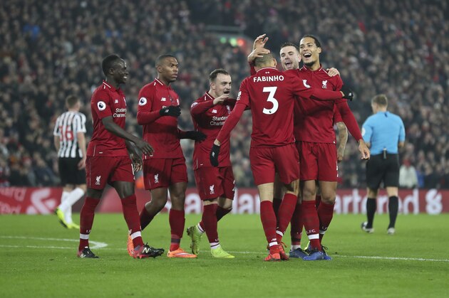 LIVERPOOL, ENGLAND - DECEMBER 26: Fabinho of Liverpool celebrates with his team mates after scoring a goal to make it 4-0 during the Premier League match between Liverpool FC and Newcastle United at Anfield on December 26, 2018 in Liverpool, United Kingdom. (Photo by James Baylis - AMA/Getty Images)