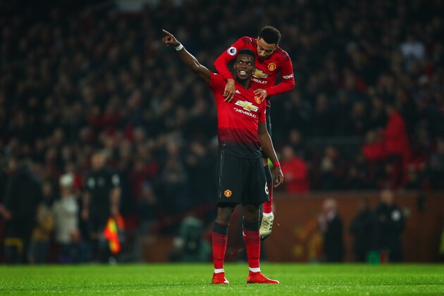MANCHESTER, ENGLAND - DECEMBER 26: Paul Pogba of Manchester United celebrates after scoring a goal to make it 3-0 during the Premier League match between Manchester United and Huddersfield Town at Old Trafford on December 26, 2018 in Manchester, United Kingdom. (Photo by Robbie Jay Barratt - AMA/Getty Images)