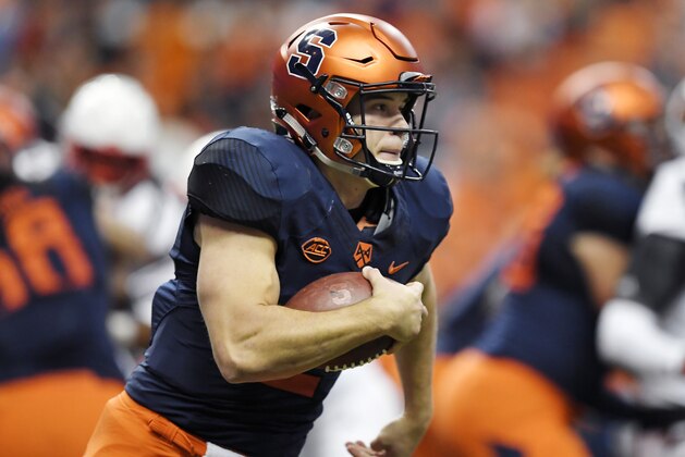 Syracuse quarterback Eric Dungey runs with the ball during the first half of an NCAA college football game against Louisville in Syracuse, N.Y., Friday, Nov. 9, 2018. Syracuse beat Louisville 54-23. (AP Photo/Adrian Kraus)