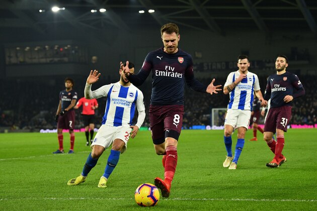 Arsenal's Welsh midfielder Aaron Ramsey reacts as the ball goes out of play during the English Premier League football match between Brighton and Hove Albion and Arsenal at the American Express Community Stadium in Brighton, southern England on December 26, 2018. (Photo by Glyn KIRK / AFP) / RESTRICTED TO EDITORIAL USE. No use with unauthorized audio, video, data, fixture lists, club/league logos or 'live' services. Online in-match use limited to 120 images. An additional 40 images may be used in extra time. No video emulation. Social media in-match use limited to 120 images. An additional 40 images may be used in extra time. No use in betting publications, games or single club/league/player publications. /         (Photo credit should read GLYN KIRK/AFP/Getty Images)