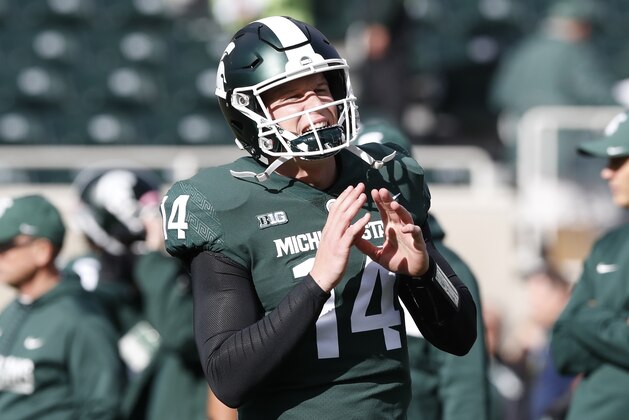 Michigan State quarterback Brian Lewerke is seen during warmups before the first half of an NCAA college football game against Michigan, Saturday, Oct. 20, 2018, in East Lansing, Mich. (AP Photo/Carlos Osorio)