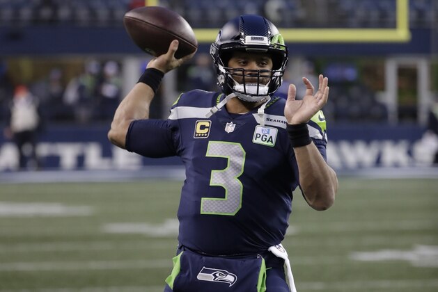 Seattle Seahawks quarterback Russell Wilson passes during warmups before an NFL football game against the Kansas City Chiefs, Sunday, Dec. 23, 2018, in Seattle. (AP Photo/Elaine Thompson)