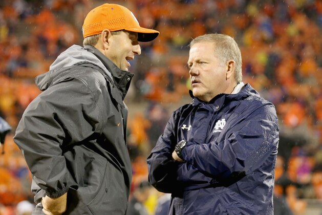 CLEMSON, SC - OCTOBER 03:  (L-R) Head coach Dabo Swinney of the Clemson Tigers talks to head coach Brian Kelly of the Notre Dame Fighting Irish before their game at Clemson Memorial Stadium on October 3, 2015 in Clemson, South Carolina.  (Photo by Streeter Lecka/Getty Images)