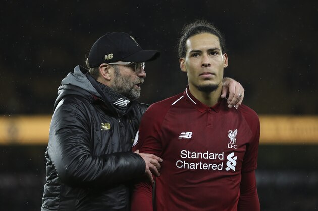 WOLVERHAMPTON, ENGLAND - DECEMBER 21: Jurgen Klopp the manager / head coach of Liverpool and Virgil van Dijk of Liverpool after the Premier League match between Wolverhampton Wanderers and Liverpool FC at Molineux on December 21, 2018 in Wolverhampton, United Kingdom. (Photo by James Baylis - AMA/Getty Images)