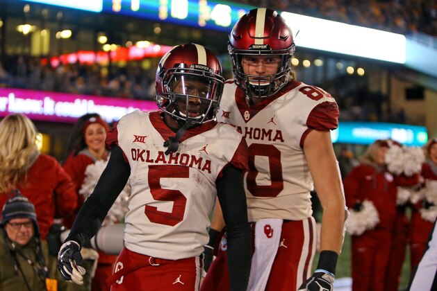 MORGANTOWN, WV - NOVEMBER 23:  Marquise Brown #5 of the Oklahoma Sooners celebrates after catching a 45 yard touchdown pass against the West Virginia Mountaineers on November 23, 2018 at Mountaineer Field in Morgantown, West Virginia.  (Photo by Justin K. Aller/Getty Images)