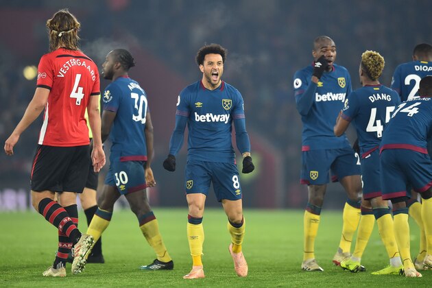 West Ham United's Brazilian midfielder Felipe Anderson (C) celebrates after scoring their first goal during the English Premier League football match between Southampton and West Ham United at St Mary's Stadium in Southampton, southern England on December 27, 2018. (Photo by Glyn KIRK / AFP) / RESTRICTED TO EDITORIAL USE. No use with unauthorized audio, video, data, fixture lists, club/league logos or 'live' services. Online in-match use limited to 120 images. An additional 40 images may be used in extra time. No video emulation. Social media in-match use limited to 120 images. An additional 40 images may be used in extra time. No use in betting publications, games or single club/league/player publications. /         (Photo credit should read GLYN KIRK/AFP/Getty Images)