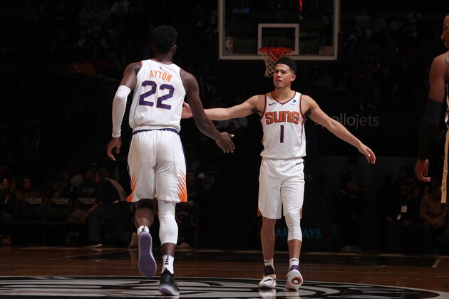 BROOKLYN, NY - DECEMBER 23: Devin Booker #1 and Deandre Ayton #22 of the Phoenix Suns high-five during a game against the Brooklyn Nets on December 23, 2018 at Barclays Center in Brooklyn, New York. NOTE TO USER: User expressly acknowledges and agrees that, by downloading and or using this Photograph, user is consenting to the terms and conditions of the Getty Images License Agreement. Mandatory Copyright Notice: Copyright 2018 NBAE (Photo by Nathaniel S. Butler/NBAE via Getty Images)