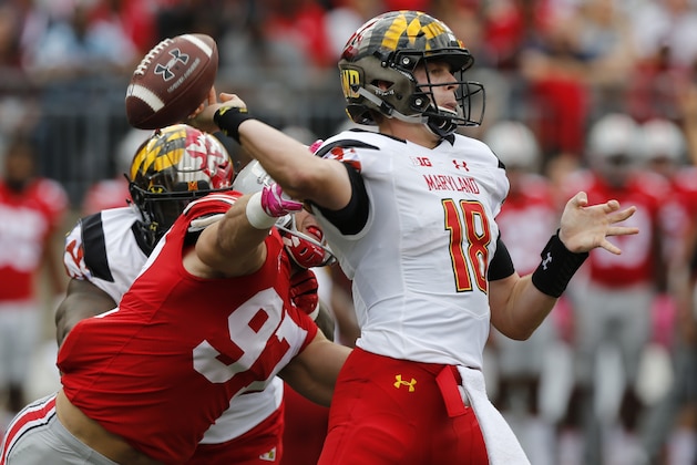 Ohio State defensive end Nick Bosa, left, causes Maryland quarterback Max Bortenschlager to fumble the ball during the first half of an NCAA college football game Saturday, Oct. 7, 2017, in Columbus, Ohio. (AP Photo/Jay LaPrete)