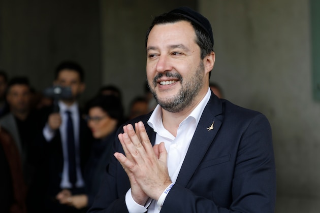 Italy's Interior Minister and Deputy Prime Minister Matteo Salvini (C) gestures after signing the guest book during his visit on December 12, 2018 to the Yad Vashem Holocaust Memorial museum in Jerusalem, which commemorates the six million Jews killed by the German Nazis and their collaborators during World War II. (Photo by MENAHEM KAHANA / AFP)        (Photo credit should read MENAHEM KAHANA/AFP/Getty Images)
