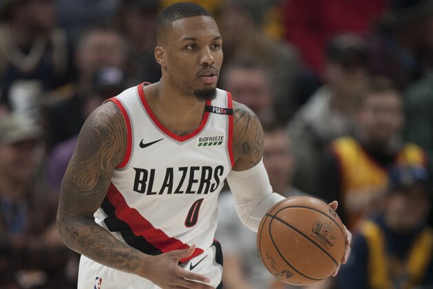 SALT LAKE CITY, UT -  DECEMBER 25: Damian Lillard #0 of the Portland Trail Blazers brings the ball up the court during their game against the Utah Jazz at the Vivint Smart Home Arena on December 25, 2018 in Salt Lake City , Utah. NOTE TO USER: User expressly acknowledges and agrees that, by downloading and or using this photograph, User is consenting to the terms and conditions of the Getty Images License Agreement. (Photo by Chris Gardner/Getty Images)