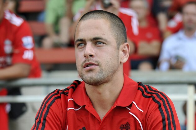 Liverpool Football Club's Joe Cole seats on the bench prior to a friendly football game versus Grasshopper Club Zurich on July 21, 2010 in Zug. Liverpool rubber-stamped the signing of Cole on a four-year contract after the England midfielder passed his medical on Wednesday. Cole had already agreed personal terms on Monday after being released by Chelsea and flew to the club's training camp in Switzerland to undergo his physical checks.  AFP PHOTO / FABRICE COFFRINI (Photo credit should read FABRICE COFFRINI/AFP/Getty Images)
