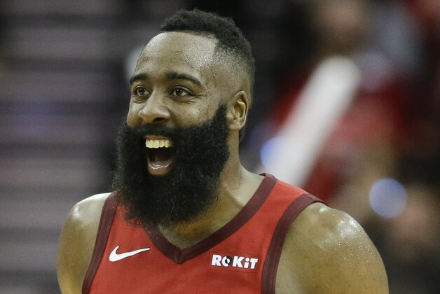 Houston Rockets guard James Harden reacts after guard Austin Rivers' three-point basket late in the second half of an NBA basketball game against the Oklahoma City Thunder, Tuesday, Dec. 25, 2018, in Houston. Houston won 113-109. (AP Photo/Eric Christian Smith)