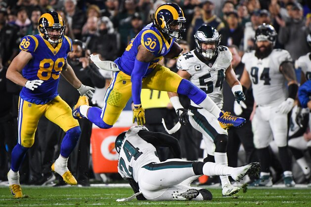 LOS ANGELES, CA - DECEMBER 16: Running back Todd Gurley #30 of the Los Angeles Rams hurdles over free safety Corey Graham #24 of the Philadelphia Eagles during the second quarter at Los Angeles Memorial Coliseum on December 16, 2018 in Los Angeles, California. (Photo by Harry How/Getty Images)
