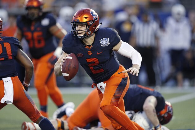 ORLANDO, FL - DECEMBER 28: Eric Dungey #2 of the Syracuse Orange runs with the ball while under pressure in the first quarter of the Camping World Bowl against the West Virginia Mountaineers at Camping World Stadium on December 28, 2018 in Orlando, Florida. (Photo by Joe Robbins/Getty Images)