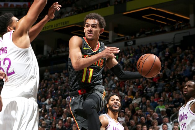 MINNEAPOLIS, MN -  DECEMBER 28:  Trae Young #11 of the Atlanta Hawks passes the ball against the Minnesota Timberwolveson December 28, 2018 at Target Center in Minneapolis, Minnesota. NOTE TO USER: User expressly acknowledges and agrees that, by downloading and or using this Photograph, user is consenting to the terms and conditions of the Getty Images License Agreement. Mandatory Copyright Notice: Copyright 2018 NBAE (Photo by David Sherman/NBAE via Getty Images)