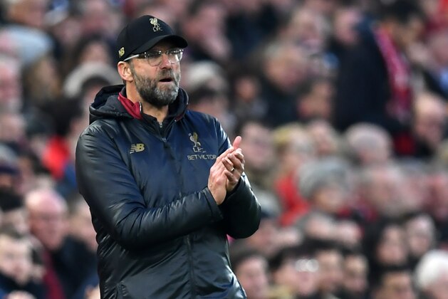 Liverpool's German manager Jurgen Klopp gestures on the touchline during the English Premier League football match between Liverpool and Newcastle United at Anfield in Liverpool, north west England on December 26, 2018. (Photo by Paul ELLIS / AFP) / RESTRICTED TO EDITORIAL USE. No use with unauthorized audio, video, data, fixture lists, club/league logos or 'live' services. Online in-match use limited to 120 images. An additional 40 images may be used in extra time. No video emulation. Social media in-match use limited to 120 images. An additional 40 images may be used in extra time. No use in betting publications, games or single club/league/player publications. /         (Photo credit should read PAUL ELLIS/AFP/Getty Images)