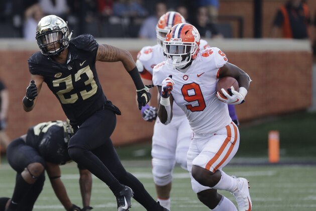 Clemson's Travis Etienne (9) runs for a touchdown against Wake Forest during the first half of an NCAA college football game in Charlotte, N.C., Saturday, Oct. 6, 2018. (AP Photo/Chuck Burton)
