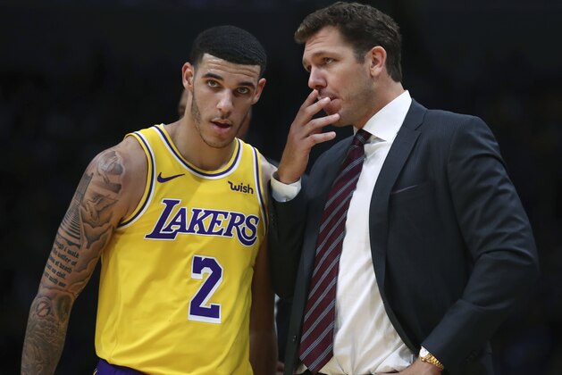 Los Angeles Lakers coach Luke Walton, right, speaks to Lonzo Ball (2) during the second half of the team's preseason NBA basketball game against the Golden State Warriors on Friday, Oct. 12, 2018, in San Jose, Calif. (AP Photo/Ben Margot)