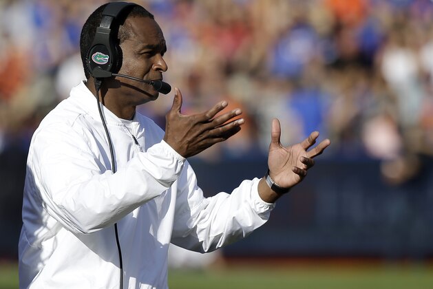 Florida interim head coach Randy Shannon directs his players during the second half of an NCAA college football game against Florida State, Saturday, Nov. 25, 2017, in Gainesville, Fla. Florida State won 38-22. (AP Photo/John Raoux)