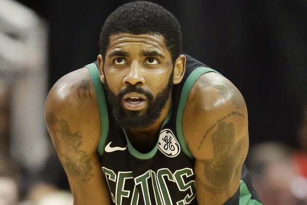 Boston Celtics guard Kyrie Irving looks at the scoreboard late in the second half of an NBA basketball game against the Houston Rockets, Thursday, Dec. 27, 2018, in Houston. (AP Photo/Eric Christian Smith)