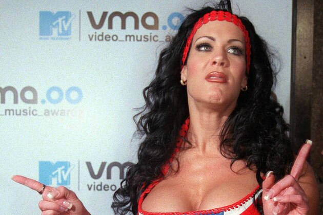 CORRECTS AGE OF DEATH TO 46 FROM 45 - FILE - In this Sept. 7, 2000, file photo, WWF wrestler Chyna arrives for the 2000 MTV Video Music Awards, at New York's Radio City Music Hall. Chyna, the WWE star who became one of the best known and most popular female professional wrestlers in history in the late 1990s, has died at age 46. Los Angeles County coroner’s Lt. Larry Dietz said Chyna, whose real name is Joan Marie Laurer, was found dead in Redondo Beach on Wednesday, April 20, 2016. (AP Photo/Tina Fineberg, File)