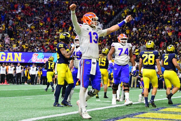 ATLANTA, GEORGIA - DECEMBER 29:  Feleipe Franks #13 of the Florida Gators celebrates a third quarter touchdown by teammate Jordan Scarlett (not pictured) against the Michigan Wolverines during the Chick-fil-A Peach Bowl at Mercedes-Benz Stadium on December 29, 2018 in Atlanta, Georgia. (Photo by Scott Cunningham/Getty Images)