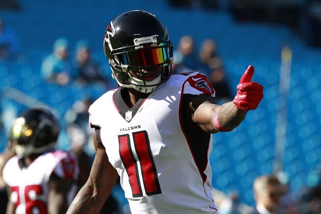 Atlanta Falcons' Julio Jones (11) gives a thumbs up as he warms up before an NFL football game against the Carolina Panthers in Charlotte, N.C., Sunday, Dec. 23, 2018. (AP Photo/Jason E. Miczek)