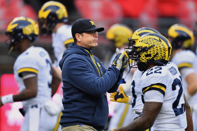 COLUMBUS, OH - NOVEMBER 24:  Head Coach Jim Harbaugh of the Michigan Wolverines watches his team warm up before a game against the Ohio State Buckeyes at Ohio Stadium on November 24, 2018 in Columbus, Ohio.  (Photo by Jamie Sabau/Getty Images)