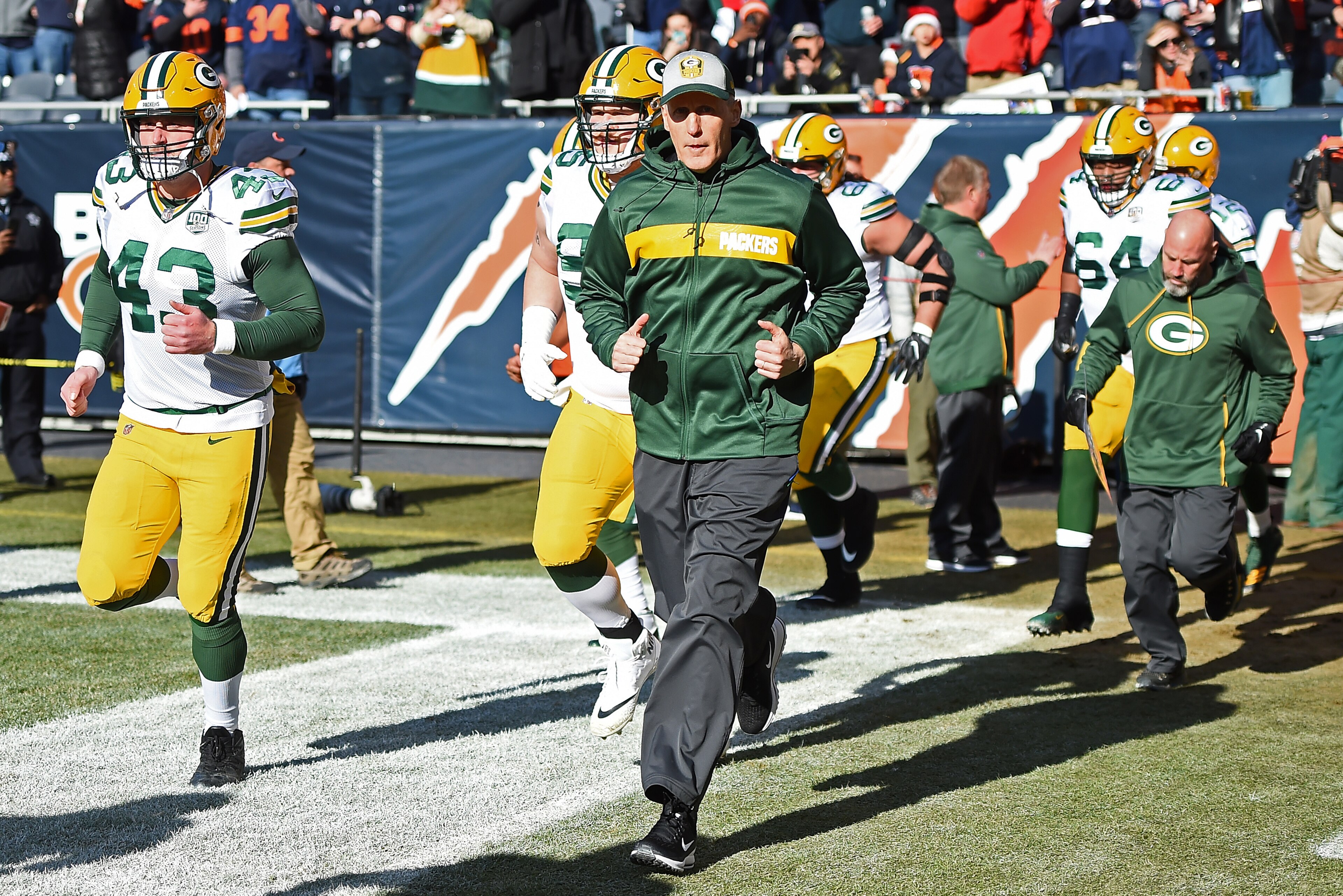 CHICAGO, IL - DECEMBER 16:  Head coach Joe Philbin of the Green Bay Packers runs onto the field at the start of the game against the Chicago Bears at Soldier Field on December 16, 2018 in Chicago, Illinois.  (Photo by Stacy Revere/Getty Images)