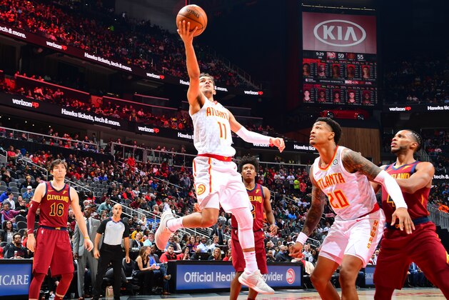 ATLANTA, GA - DECEMBER 29: Trae Young #11 of the Atlanta Hawks goes to the basket against the Cleveland Cavaliers on Deceber 29, 2018 at State Farm Arena in Atlanta, Georgia.  NOTE TO USER: User expressly acknowledges and agrees that, by downloading and/or using this Photograph, user is consenting to the terms and conditions of the Getty Images License Agreement. Mandatory Copyright Notice: Copyright 2018 NBAE (Photo by Scott Cunningham/NBAE via Getty Images)