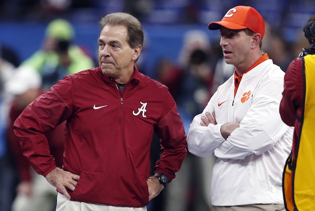 Alabama head coach Nick Saban, left, and Clemson head coach Dabo Swinney talk before the Sugar Bowl semi-final playoff game for the NCAA college football national championship, in New Orleans, Monday, Jan. 1, 2018. (AP Photo/Gerald Herbert)